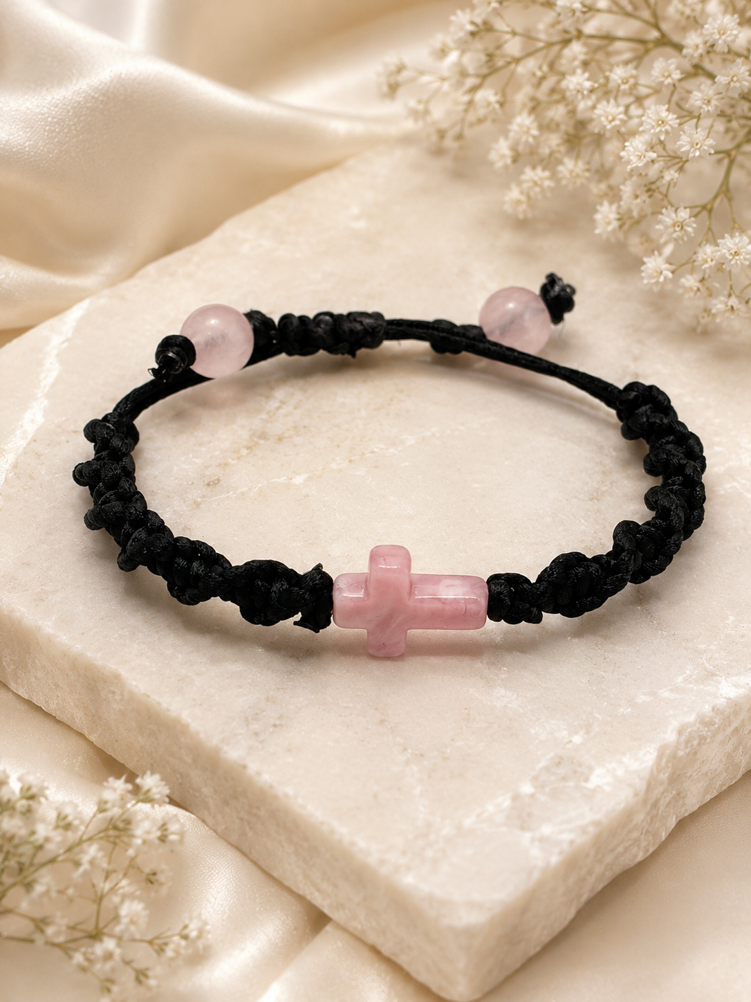 Braided Bracelet with a pink Marbly Cross